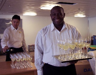 Photo of waiter with champagne goes here.