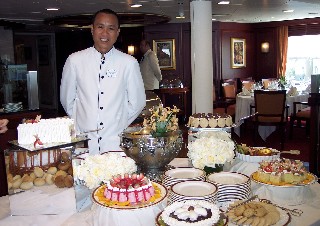 Photo of dining room waiter and dessert area goes here.