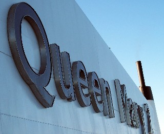 Photo of name of QM2 onboard the ship goes here.