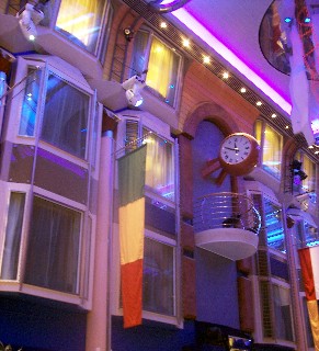 Photo of the windows of interior cabins overlooking the Grand Promenade goes here.