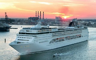 Photo of MSC Opera sailing at sunset goes here.