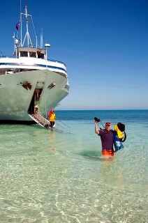 Photo of Blount ship in shallow water with bow ramp down. Photo by Kathy Witt; all rights reserved.