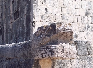 Photo of the serpent sculpture on the Great Ball Court goes here.