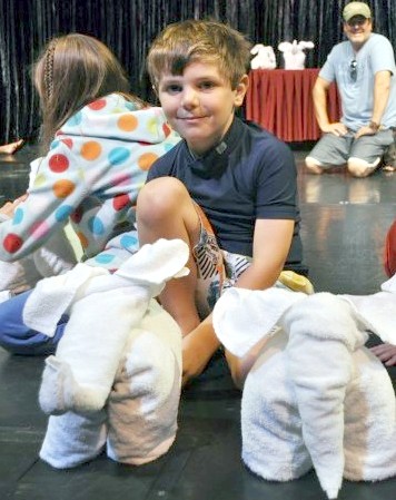 Casey and folded animal towels onboard Carnival Splendor.*