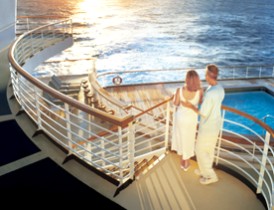 Photo of couple on a balcony at sunset goes here.