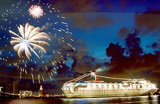 The Port of Miami with night fireworks and a Carnival ship is shown here.