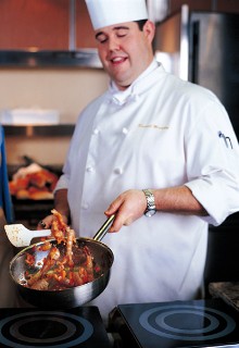 Photo of chef in Culinary Arts Center goes here.