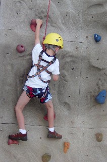 Photo of Aidan on the rock climbing wall goes here.