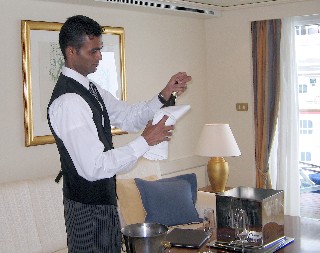 Photo of butler opening champagne goes here.