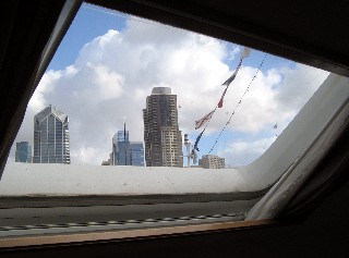 Photo of window in the closet with skyline view goes here.