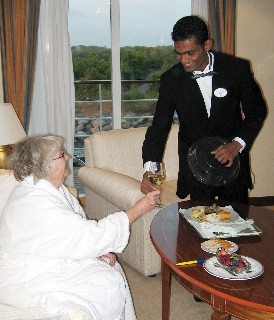 Photo of butler serving in the suite goes here. 
