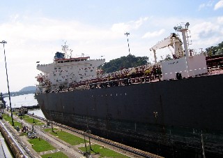 Photo of ship in the Miraflores Locks goes here.