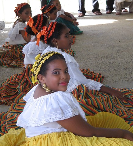Photo of beautiful childen in native costumes goes here.