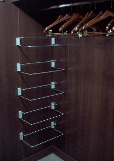 Photo of one side of the walk in closet goes here.