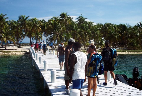 Photo of group getting off on the Half Moon Caye pier.