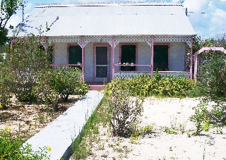Photo of gingerbread-like Caribbean home goes here.