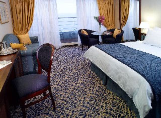 Photo of penthouse accommodations on Regatta-class ships goes here.