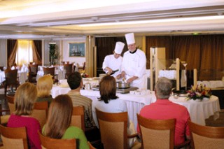 Photo of an onboard cooking demonstration goes here.