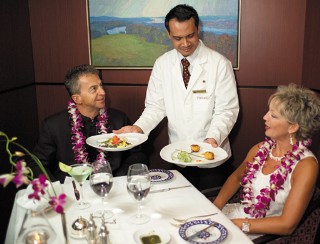 Photo of diners in the Pinnacle Grill goes here.