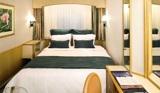 Photo of stateroom with new bedding goes here.