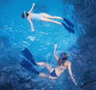 Photo of two female snorkelers goes here.