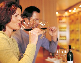Photo of couple in wine bar goes here.