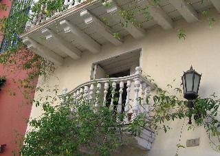 Photo of balcony with greenery goes here.