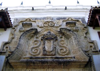 Photo of the Stonework above the doorway of the Inquisition Palace goes here.