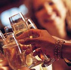 Photo of guests enjoying a glass of champagne goes here.