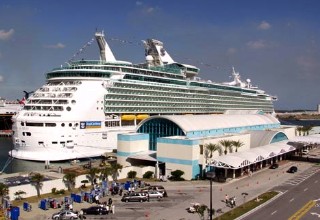 Photo of a Royal Caribbean ship at a Port Canaveral cruise terminal goes here.