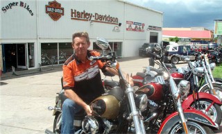 Photo of Harley manager and bikes goes here.