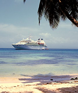 Photo of a Seabourn ship anchored off a Caribbean island goes here.