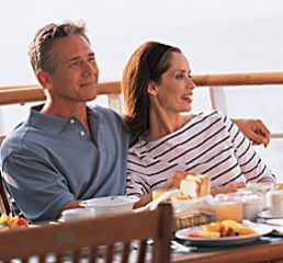 Couples relaxes on deck prior to a day of shopping with a Personal Shopper.