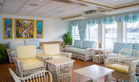 Photo of top deck cafe on Queen of the Mississippi goes here.*